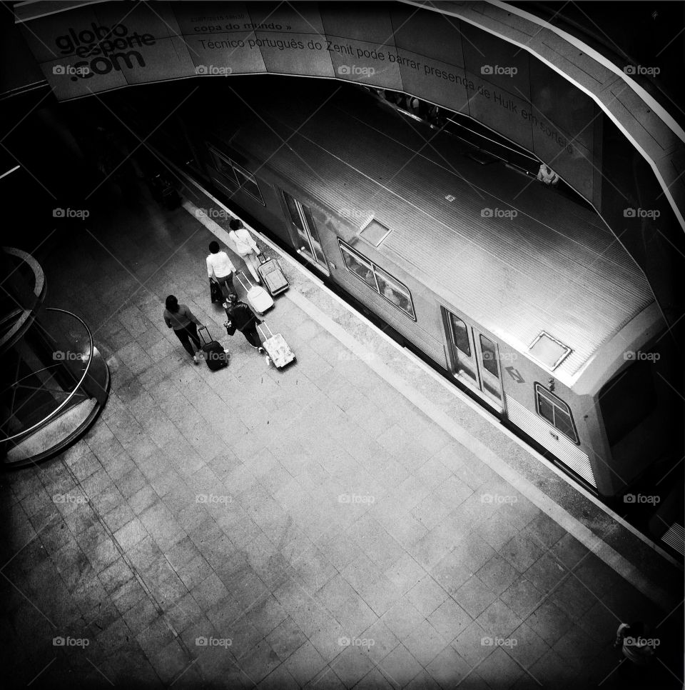 People carrying bags at subway station