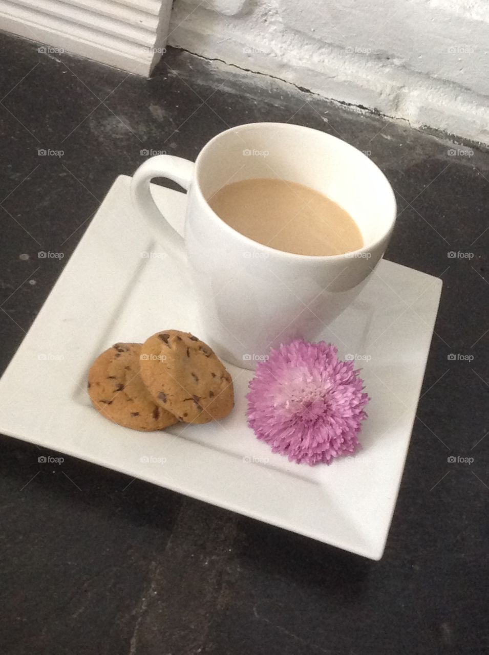 Enjoying a cup of coffee outdoors on a beautiful spring day.