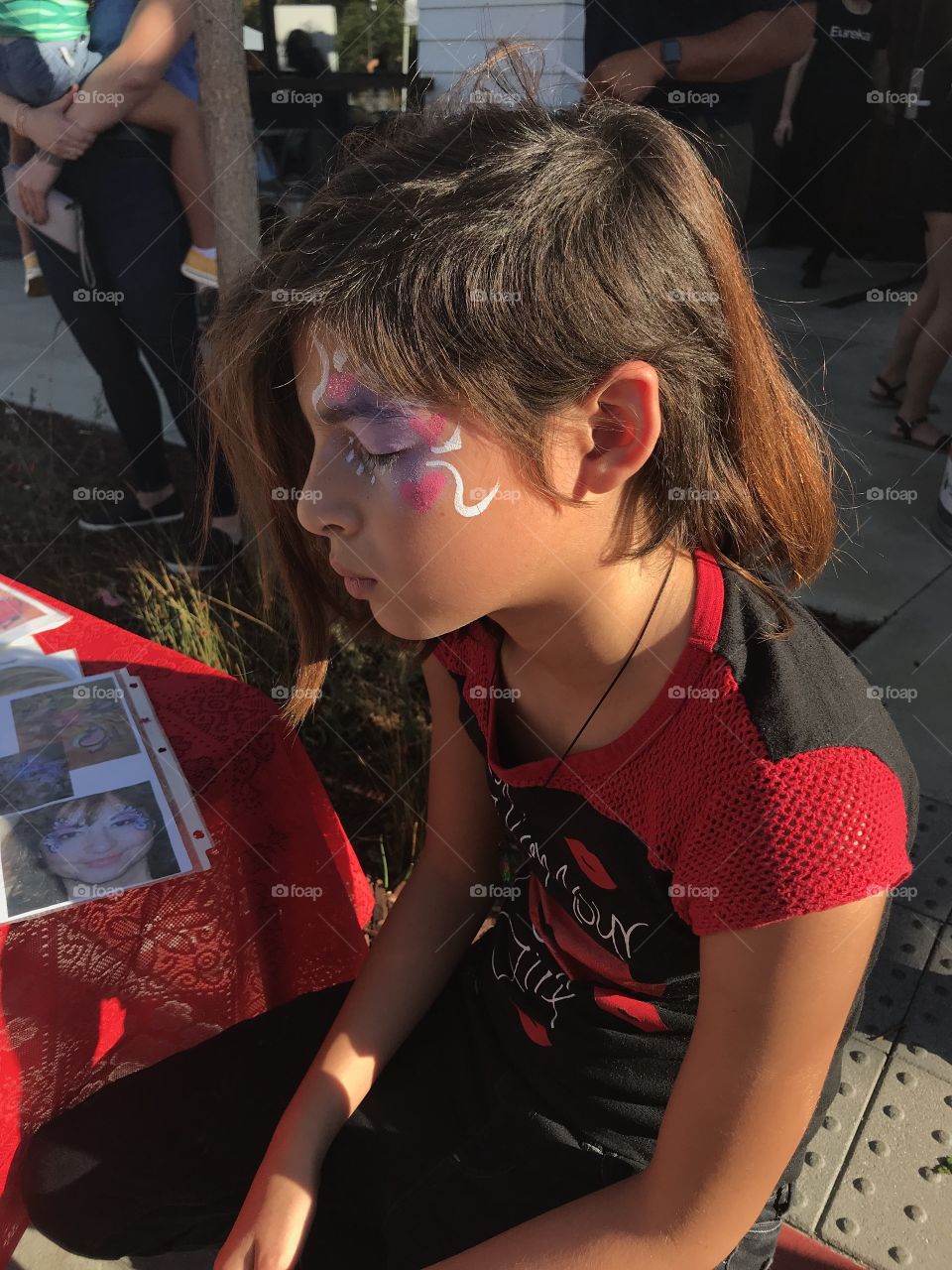 Young girl with face painted
