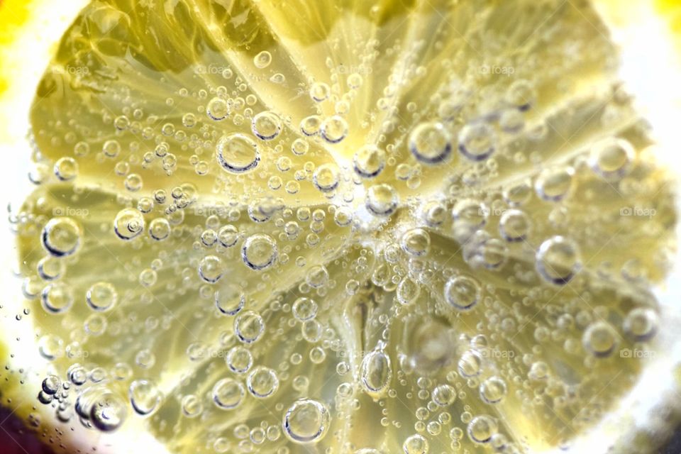 Bubbles on a lemon in water