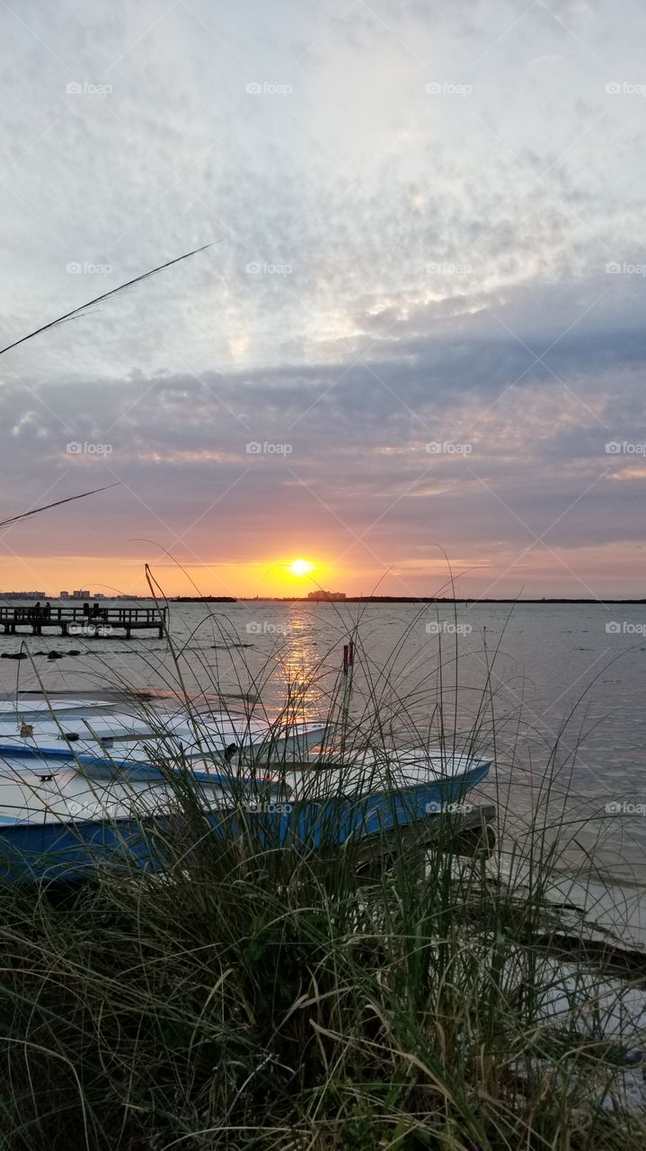 Boats on the water at sunset