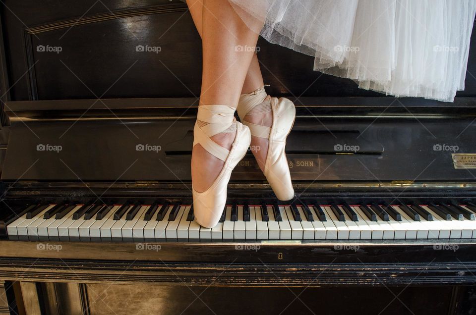 Ballerina Standing on A Piano