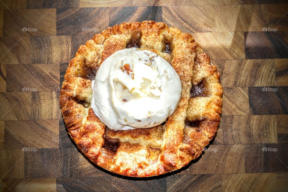 apple pie with a scoop of almond praline ice cream