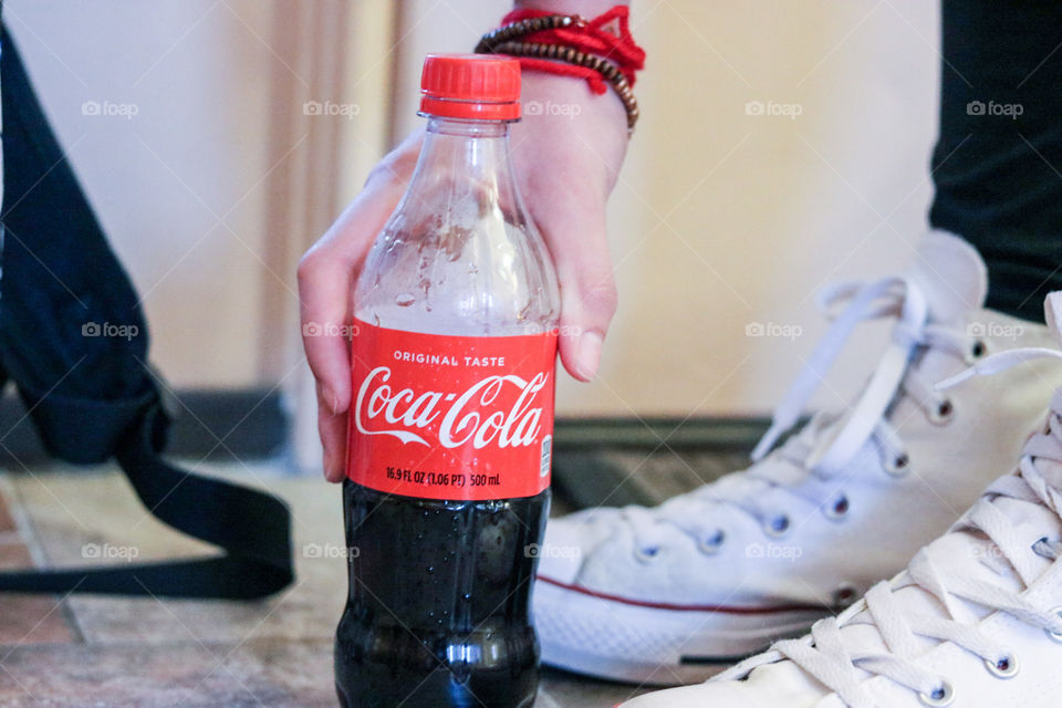 CocaCola -Reaching for a cold refreshing cola.