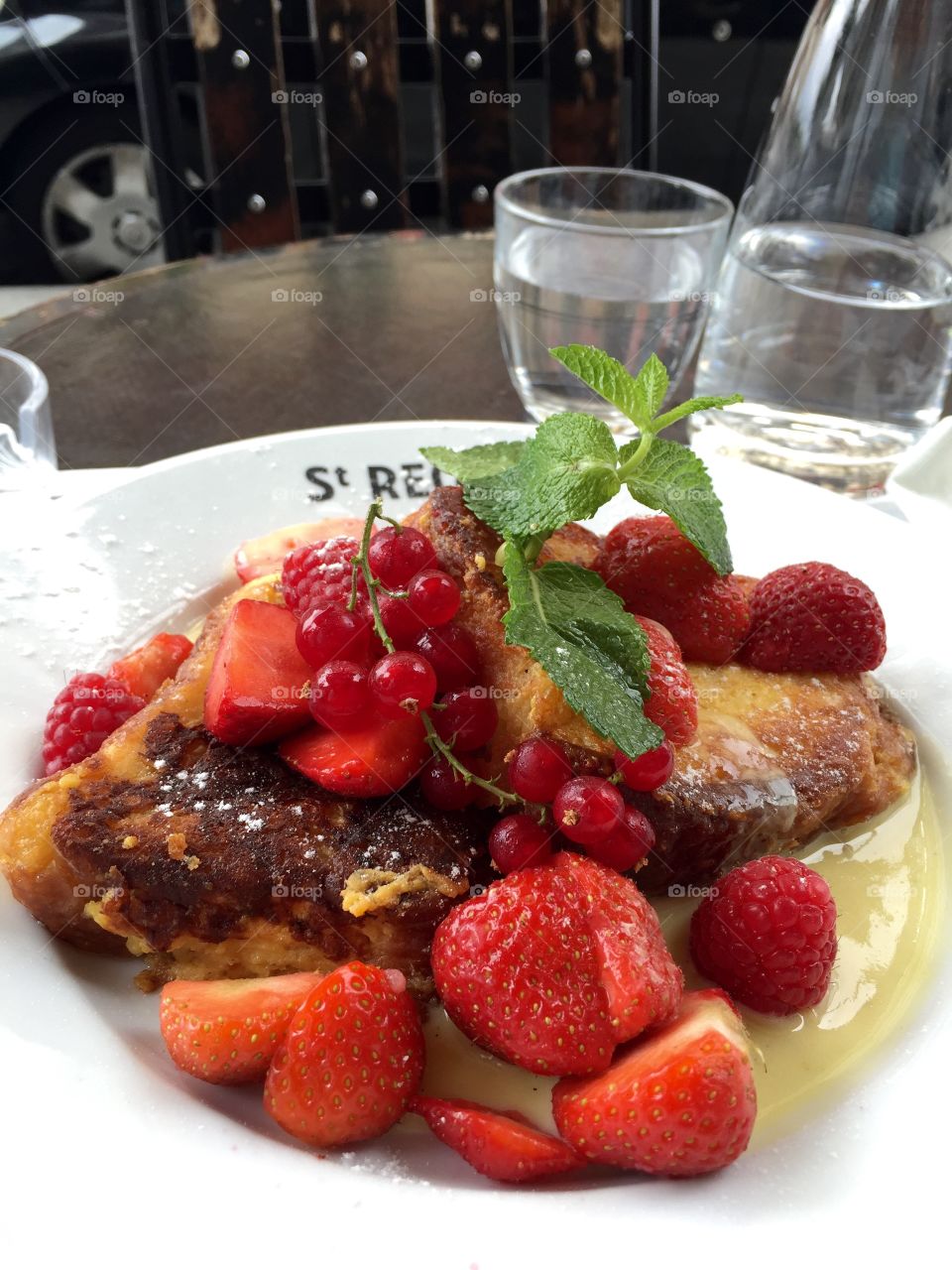 French Toast with Berries. French toast with berries and custard at Cafe St Regis on the Ile St Louis in Paris.