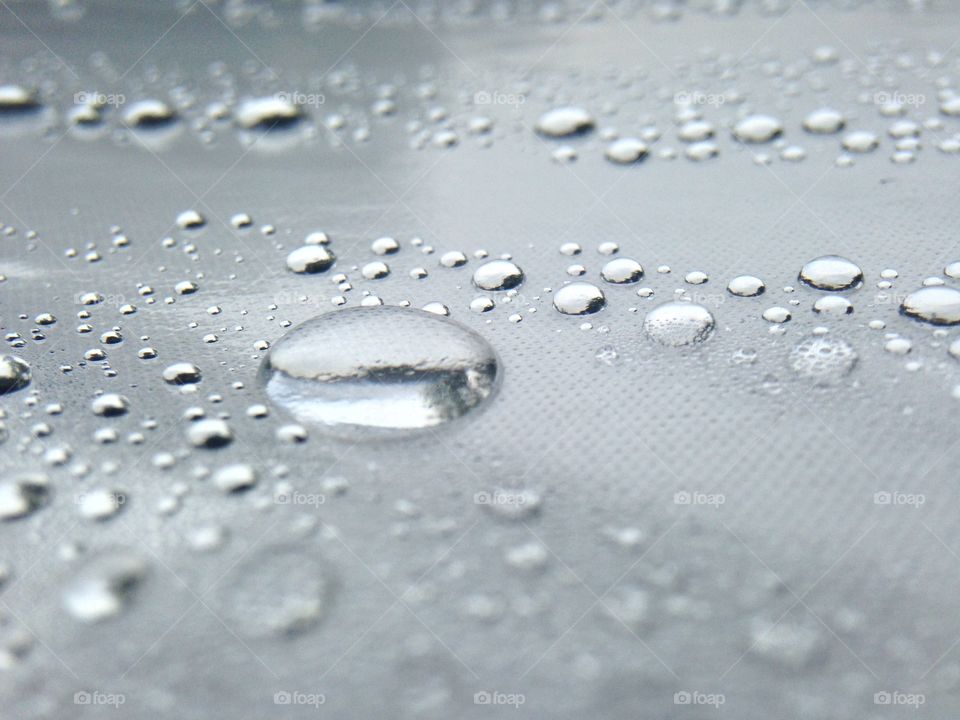 Water drops on silver surface. Water drops on silver surface 