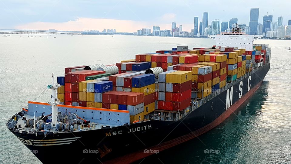 Container ship is departing from Miami, Florida.
