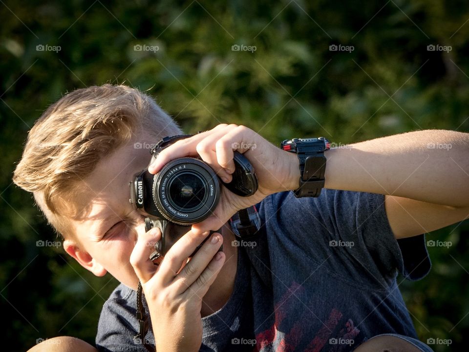 Teen boy with camera.  