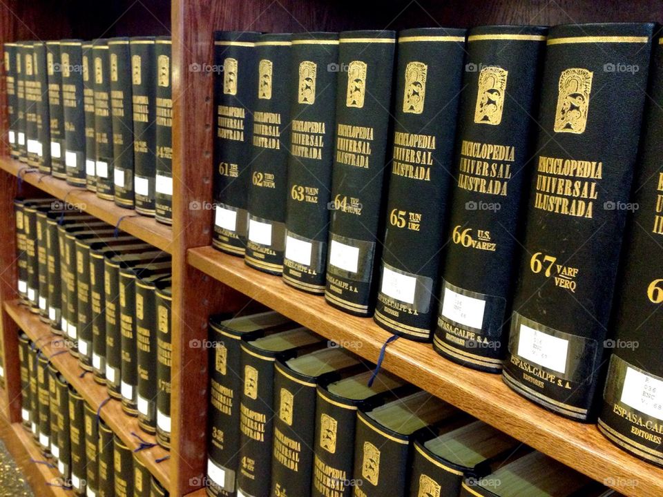 Encyclopedias on bookshelf in school library