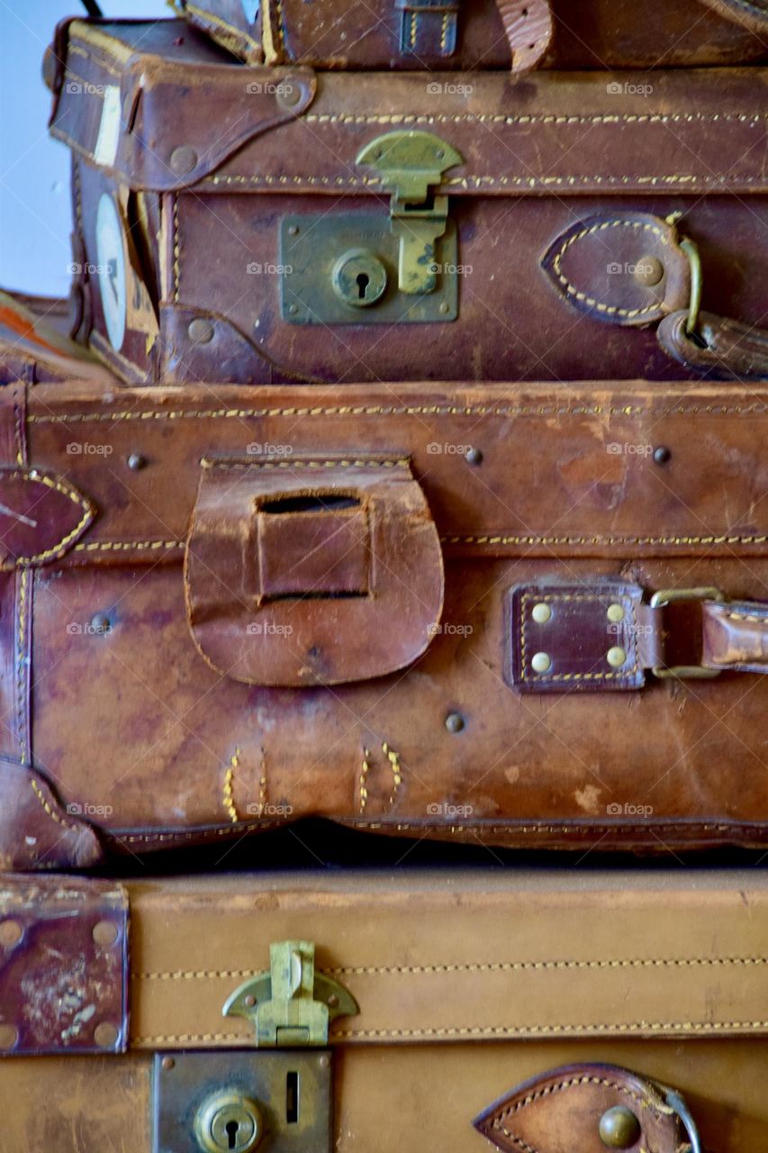 Colors of autumn, Rich gold, brown and russet leather antique suitcases still life 
