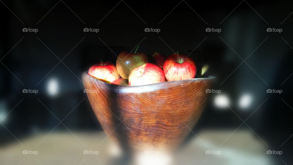 Delicious red apples in wood bowl