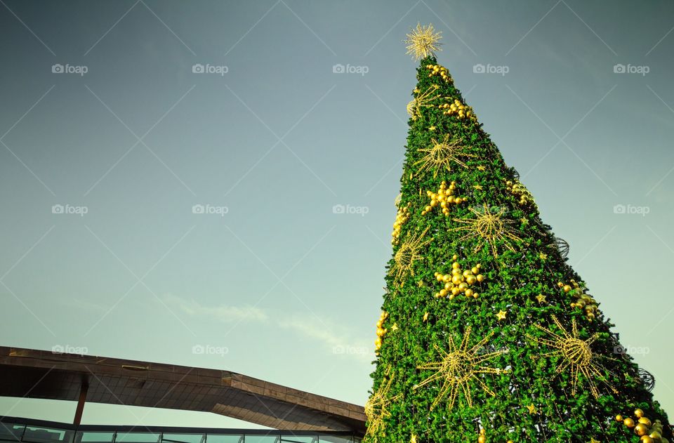 Top of artificial Christmas fir tree near the shopping centre in Moscow