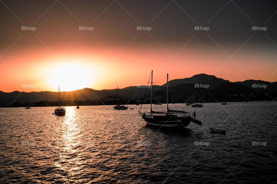 The boats also love to watch the sunset after a long day of sailing on the sea