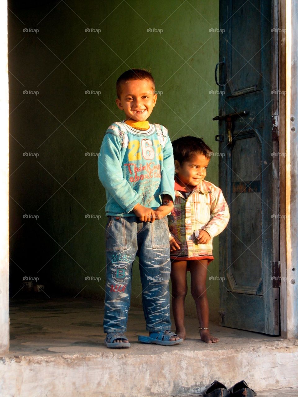 Children in India. Children in the doorway of their home, India