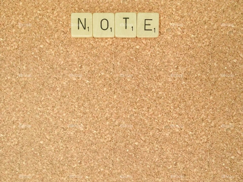 Word on corkboard background