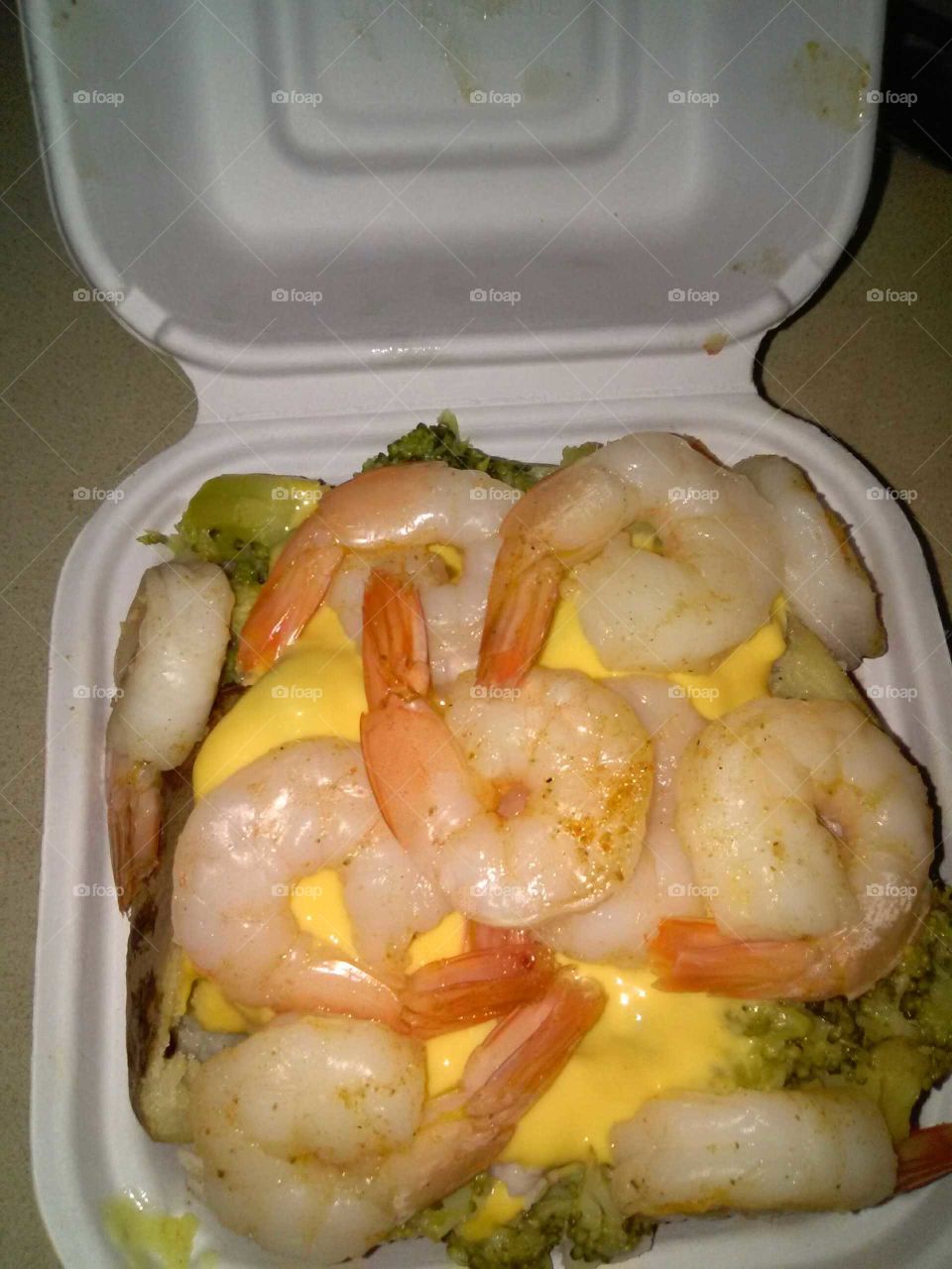 garlic butter baked potato with cheese broccoli and shrimp