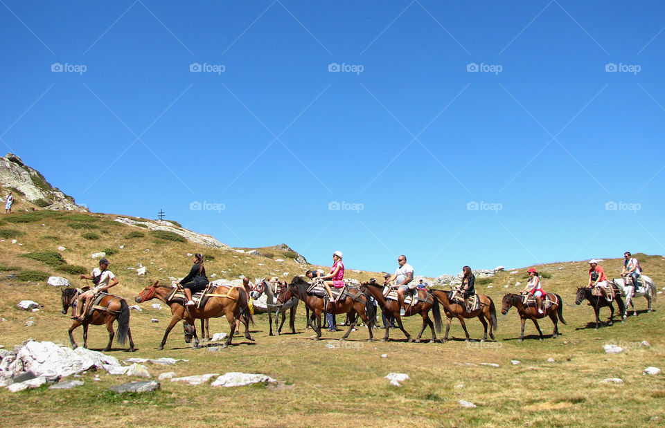 Tourists, horses, sky... Rila mountain, Bulgaria
