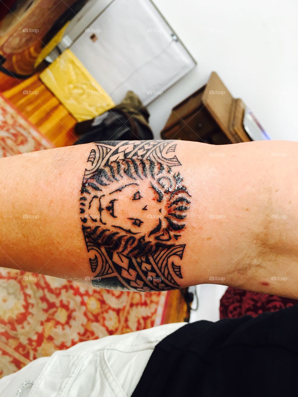 Lion armband tattoo
