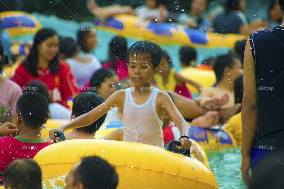 Boy standing swimming pool