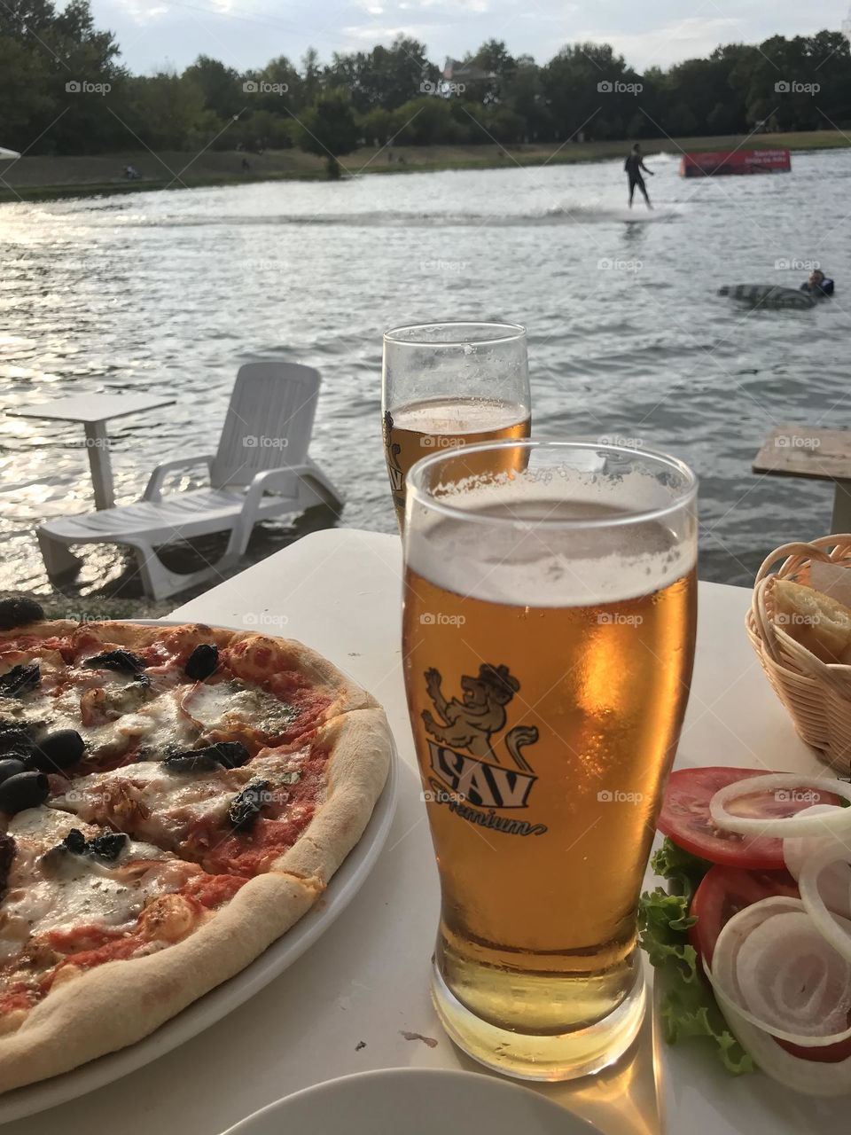 pizza and beer on the seashore,vacation  team 