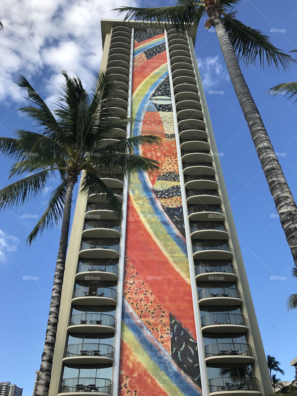 Colorful building with palm trees  at Hawaii Oahu Honolulu Waikiki beach 