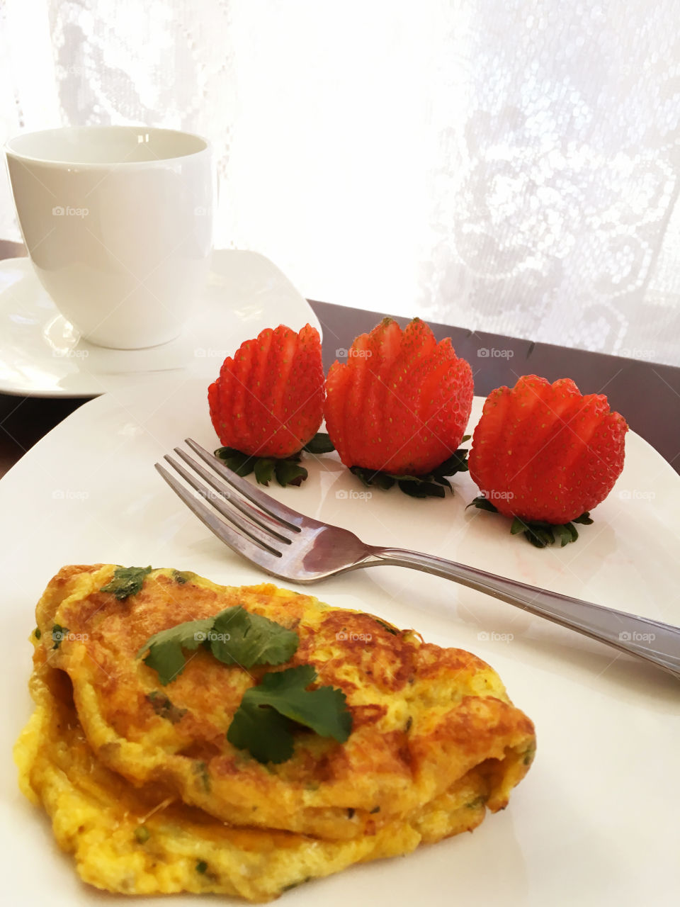 Close-up of omelette with strawberry