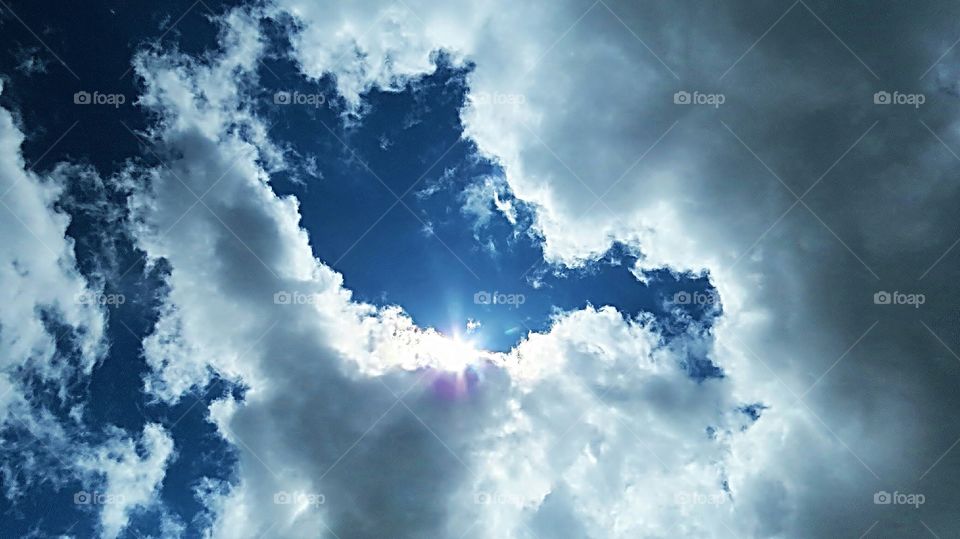 Blue sky Puffy Clouds