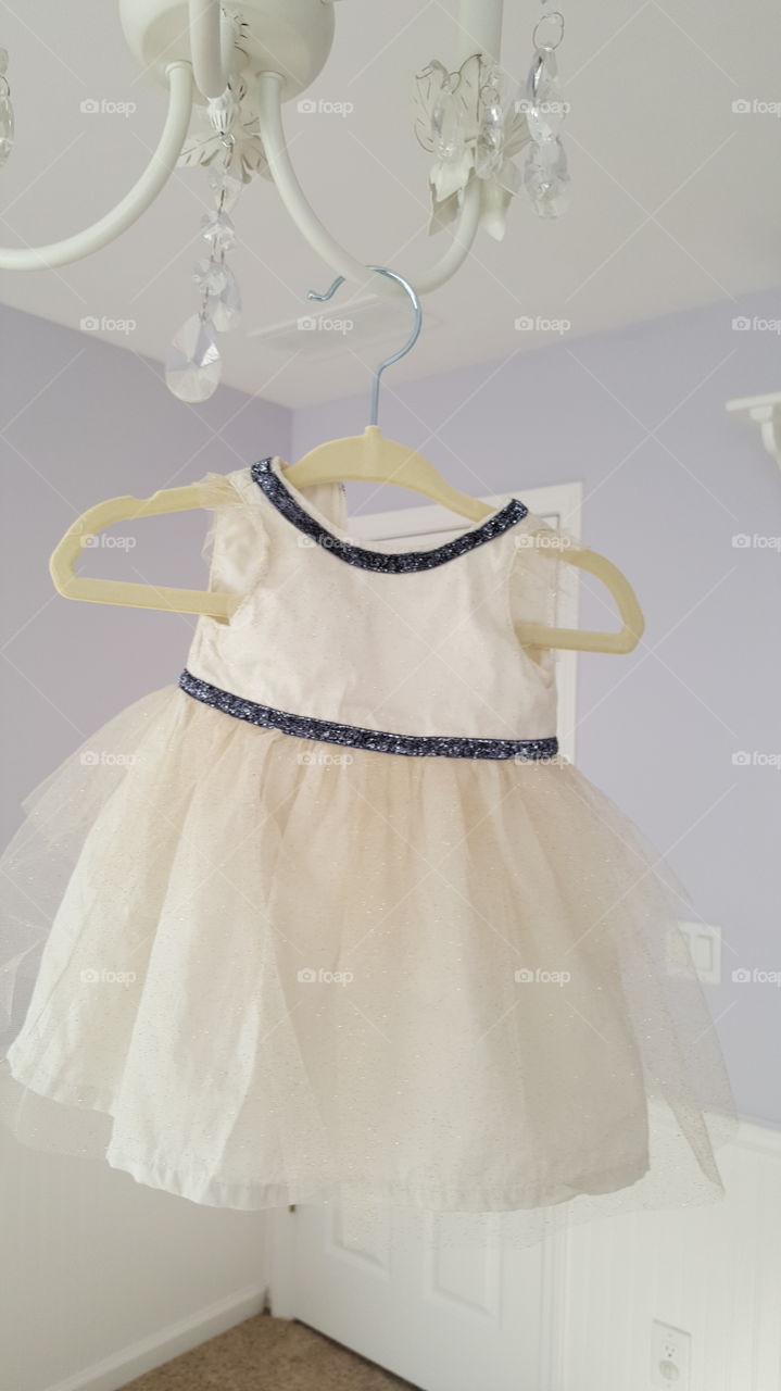 Baby girls dress on a hanger