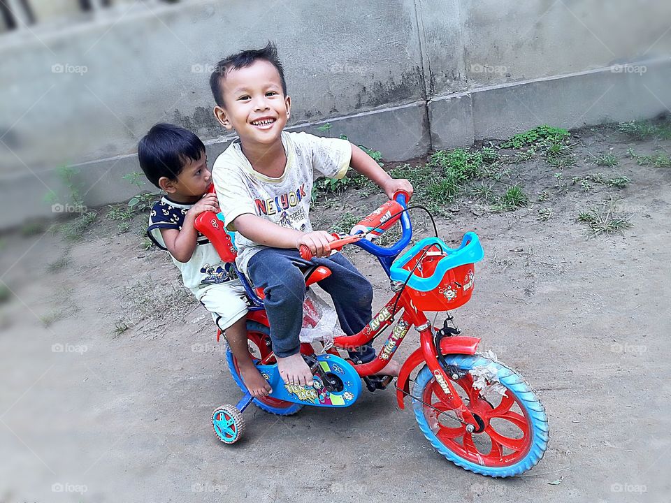 Littile boy rideing Bicycle.
