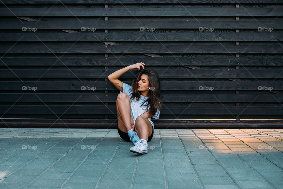 Pretty woman sitting on floor