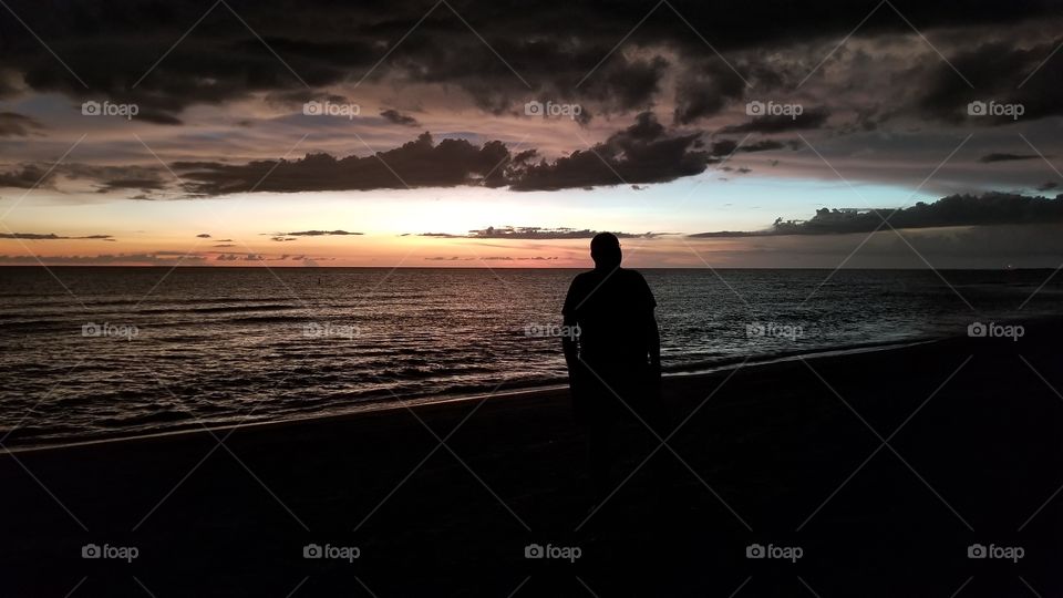 silhouette of a man at sunset Venice Beach Florida