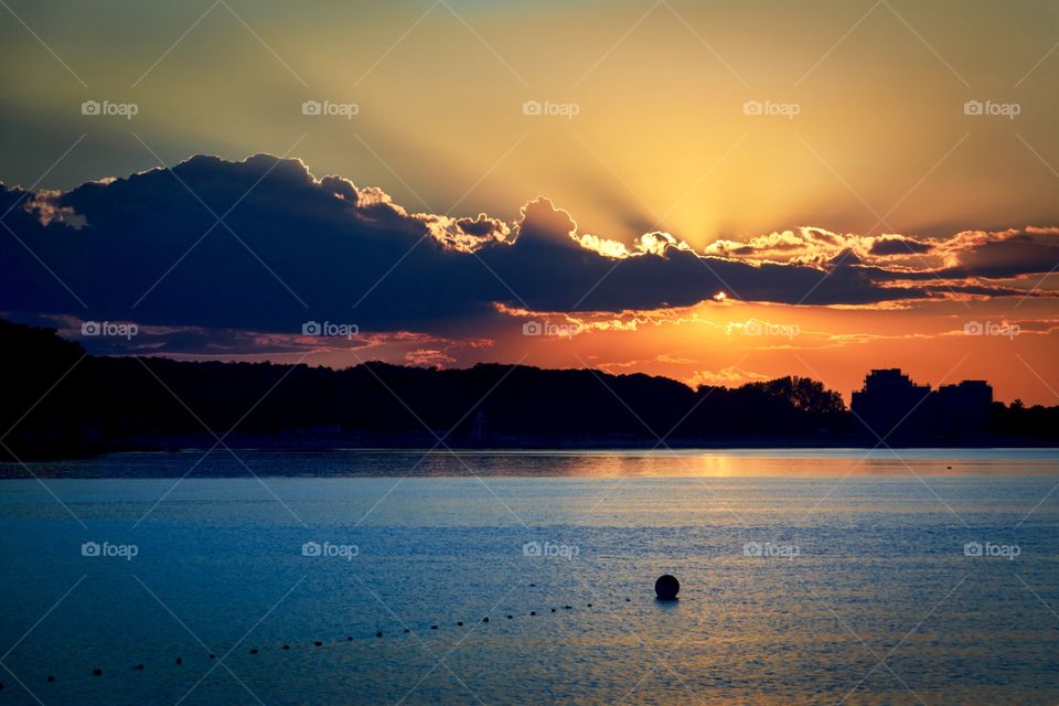Beautiful sunset over the sea and colourful sky and sunlight