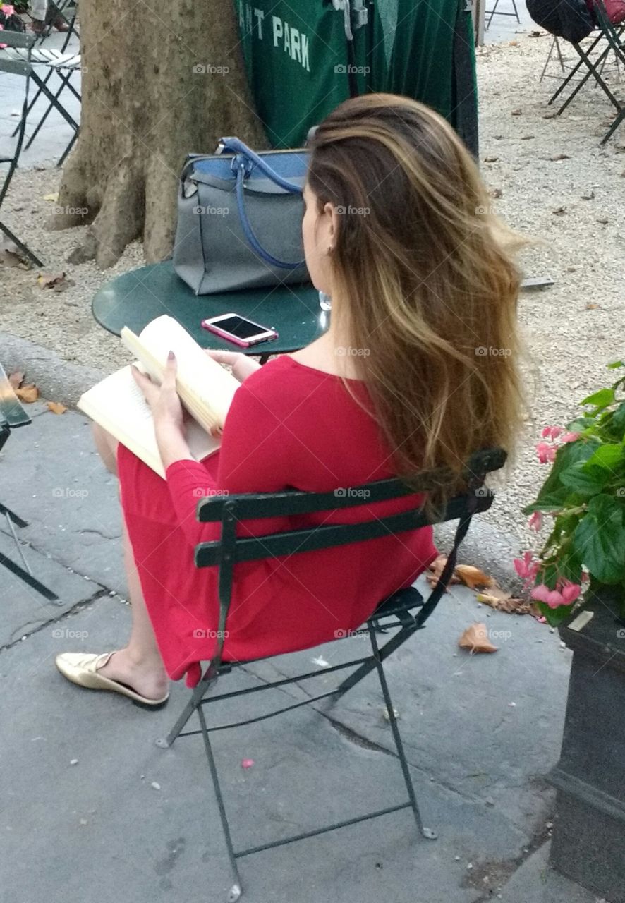 Girl in Park Reading a Book