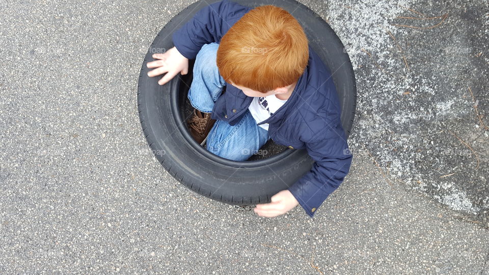 Child in Tire