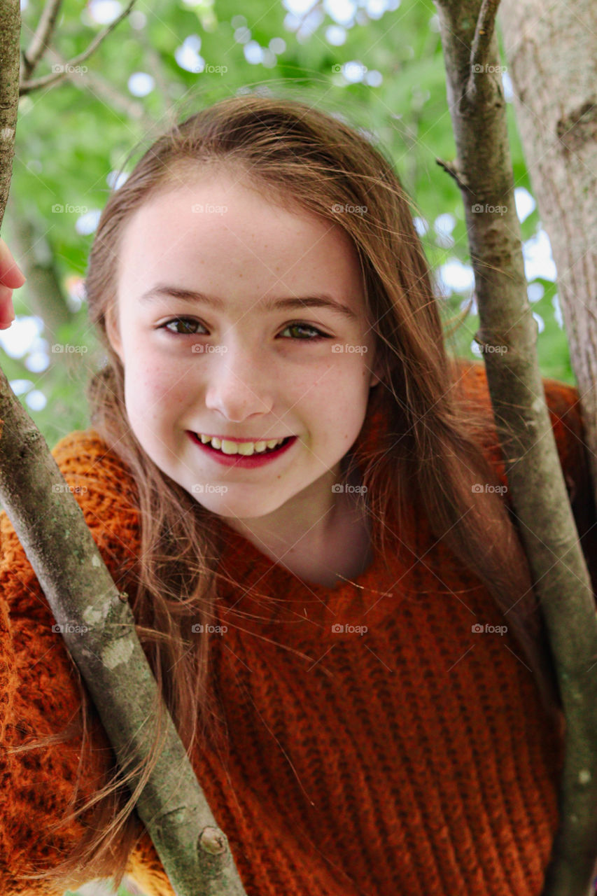 girl in brown sweater