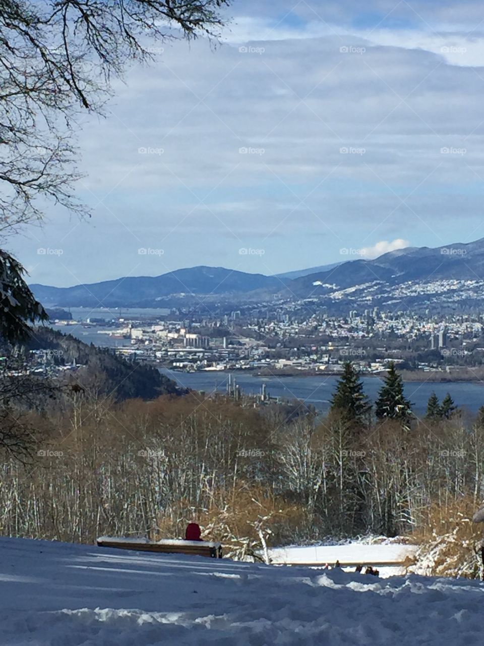 View of snowy North Vancouver from Burnaby Mountain on a crisp winter day