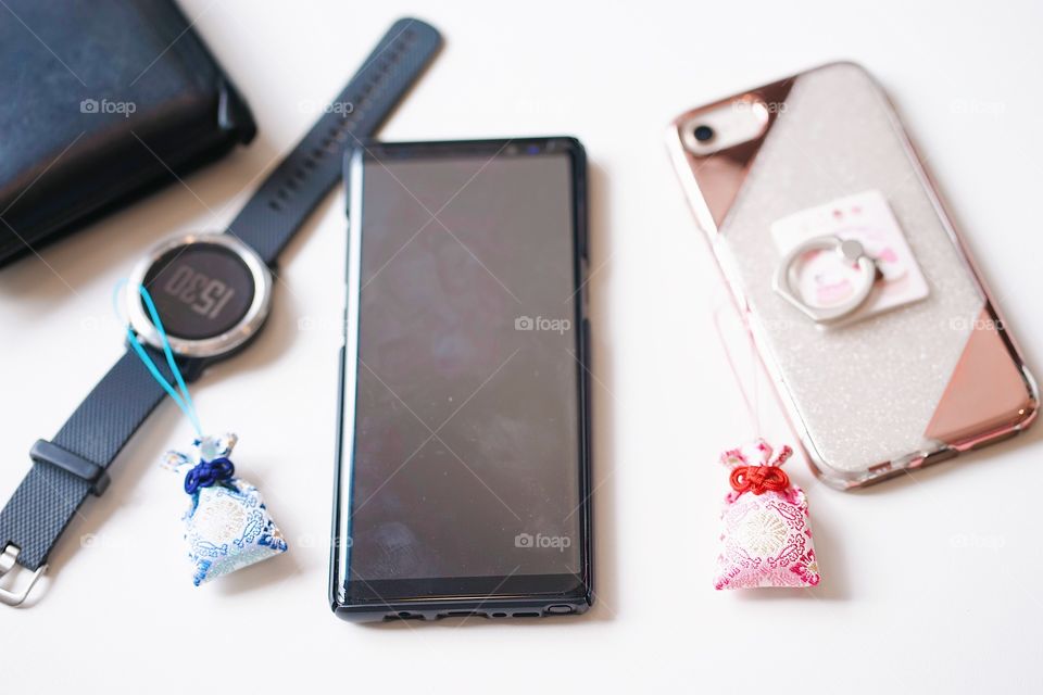 Japanese amulet or lucky charms. A couple amulets Japanese charms to bring good luck in love and other personal belongings. Selective focus on the pink amulet