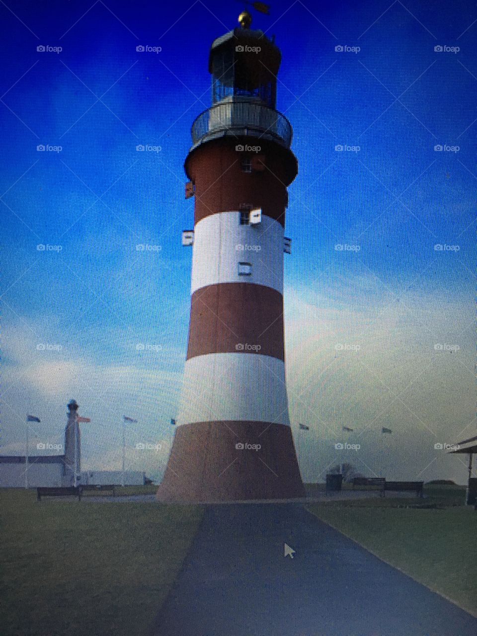 The famous Plymouth Hoe, UK Lighthouse on a beautiful sunny day in the resort.

