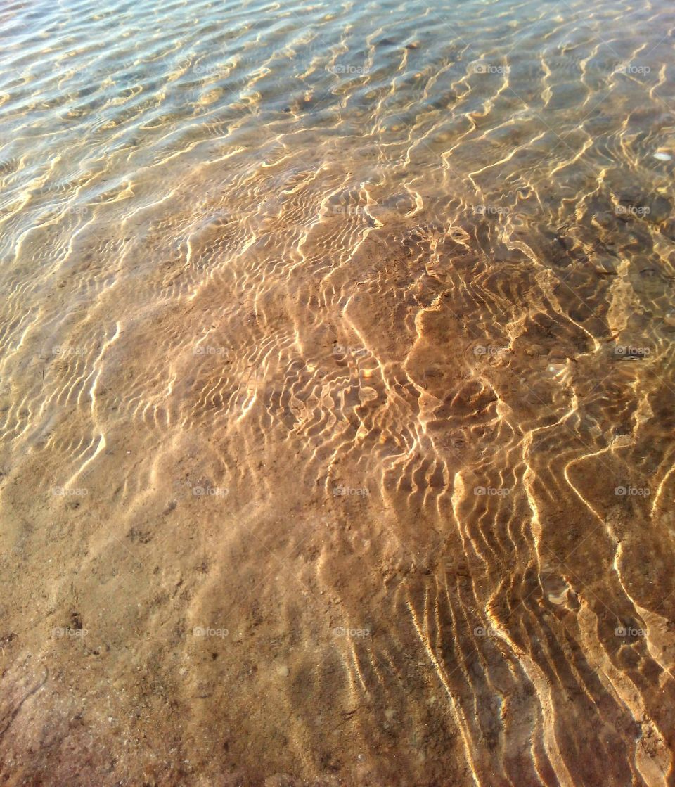 Elevated view of rippled water on beach