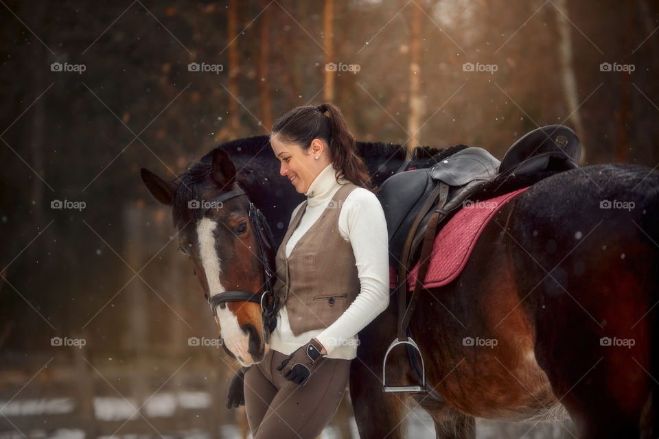 Young beautiful woman with horse outdoor portrait at spring day