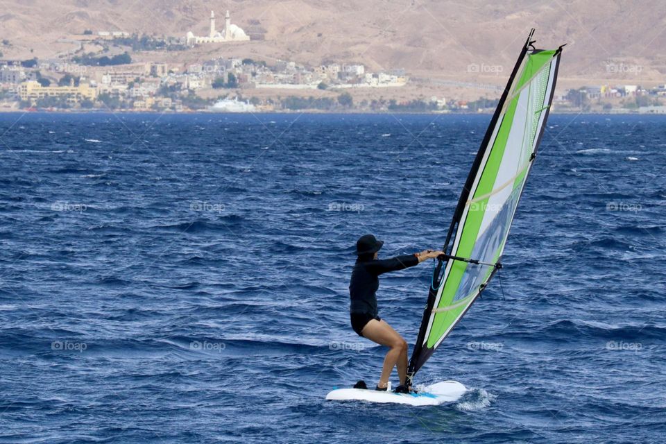 Woman on a wind board 