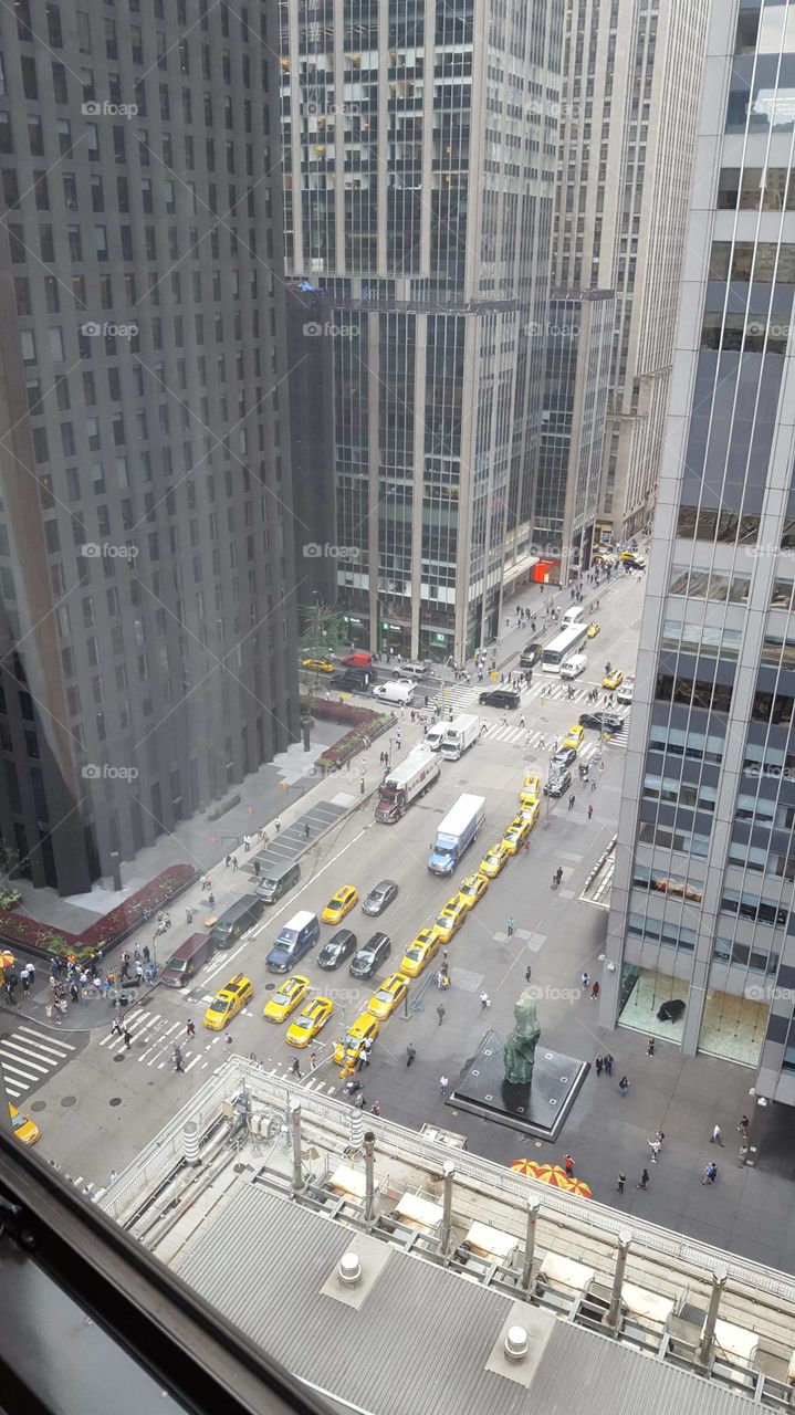 Hotel window view New York, skyscrapers and yellow cabs!