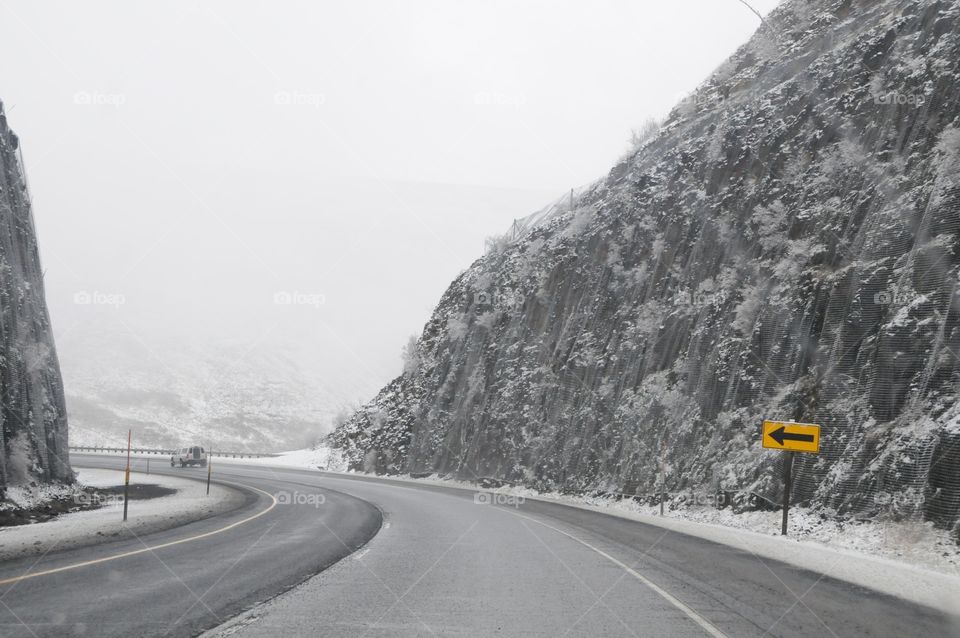 Yellow road signs. I70 Utah. Surprise snow storm on road trip. 