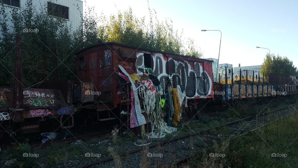 Abandoned cargowagon made into a makeshift home by homeless people in Stockholm, Sweden.