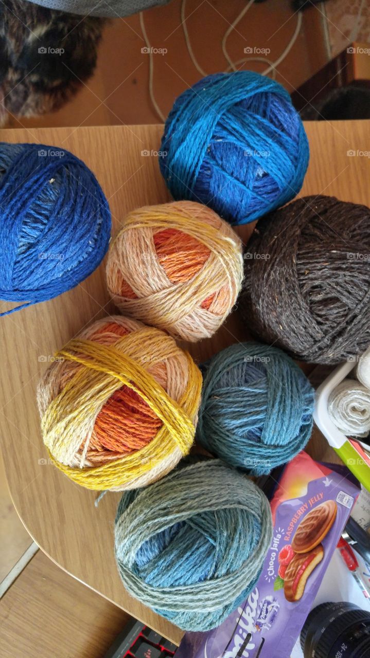 Colorful wool yarns in balls. Hand crafts, home made, knitting.