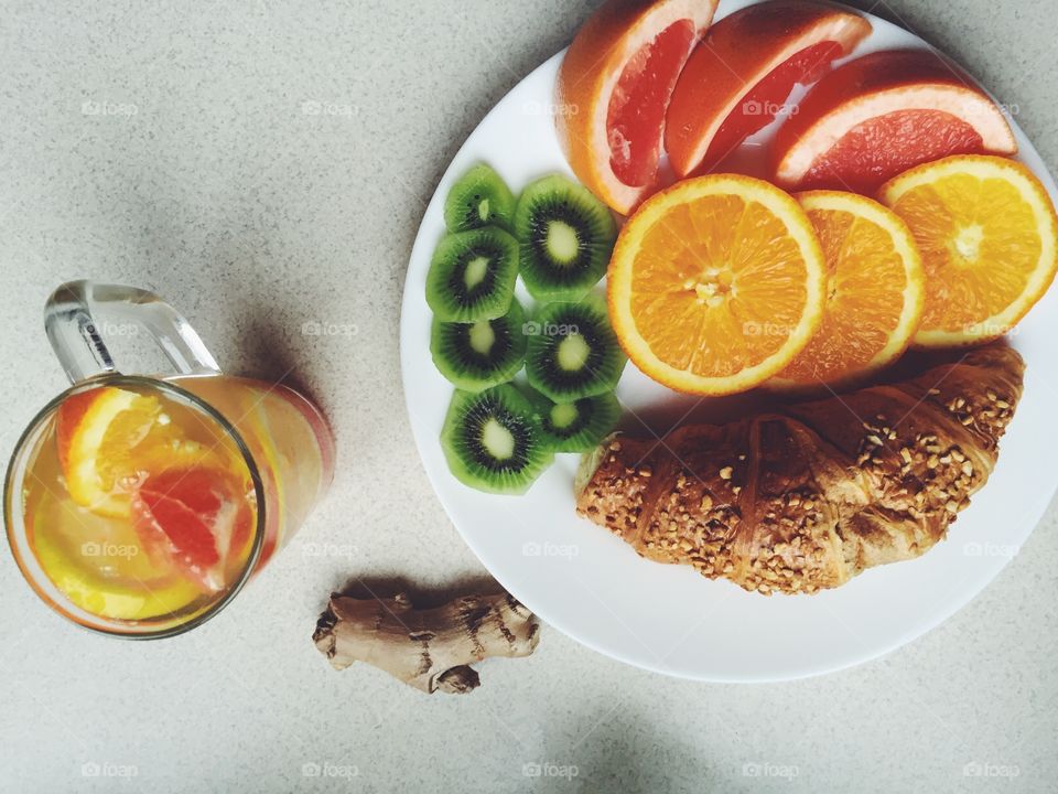 Croissant and fruits for breakfast