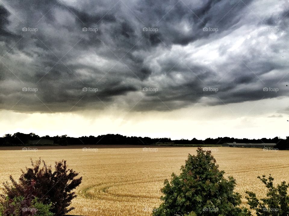 Storm clouds over farm