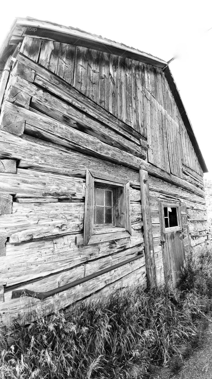 This rustic old barn still stands by 4 Mile Road, It's weathered timbers and windows holding up against the trials of time.