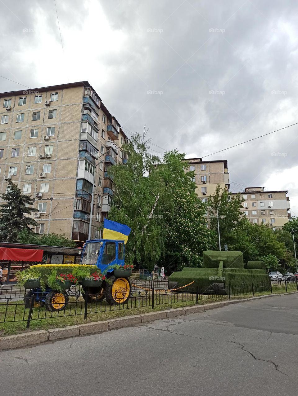 Kyiv. Ukraine. a flowerbed in the form of a tractor that drags a captured russian tank
