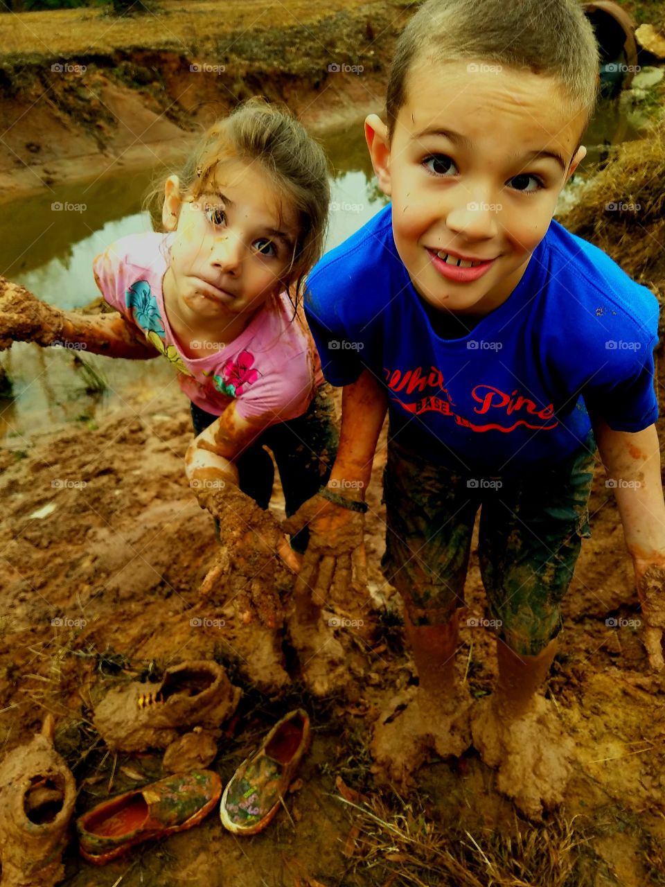 boy and girl after playing in the mud in Vidor Texas United States of America January 2018